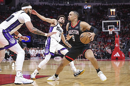Nov 4, 2023; Houston, Texas, USA; Houston Rockets forward Dillon Brooks (9) steps back to shoot the ball as Sacramento Kings center JaVale McGee (00) defends during the second quarter at Toyota Center. Mandatory Credit: Troy Taormina-USA TODAY Sports