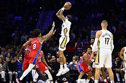 Mar 8, 2024; Philadelphia, Pennsylvania, USA; New Orleans Pelicans forward Brandon Ingram (14) shoots over Philadelphia 76ers guard Kelly Oubre Jr (9) in the first quarter at Wells Fargo Center. Mandatory Credit: Kyle Ross-USA TODAY Sports