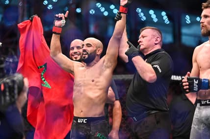 Sep 7, 2019; Abu Dhabi, UAE; Ottman Azaitar (red gloves) celebrates after defeating Teemu Packalen (blue gloves) during UFC 242 at The Arena. Mandatory Credit: Per Haljestam-USA TODAY Sports
