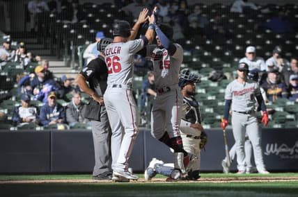 Apr 1, 2021; Milwaukee, Wisconsin, USA; Minnesota Twins center fielder Byron Buxton (25) is congratulated by teammate Max Kepler (26) after hitting a home run in the seventh inning against the Milwaukee Brewers at American Family Field. Mandatory Credit: Michael McLoone-USA TODAY Sports