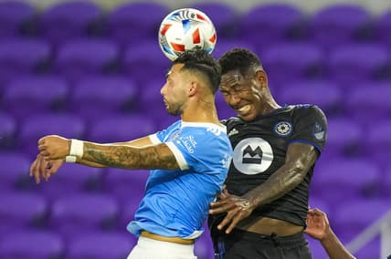 Jul 7, 2021; Orlando, Florida, USA; New York City midfielder Valentin Castellanos (11) and CF Montr  al forward Romell Quioto (30) go for the header during the first half at Exploria Stadium. Mandatory Credit: Jasen Vinlove-USA TODAY Sports