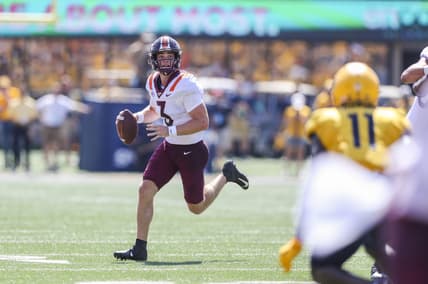 Sep 18, 2021; Morgantown, West Virginia, USA; Virginia Tech Hokies quarterback Braxton Burmeister (3) runs out of the pocket during the second quarter against the West Virginia Mountaineers at Mountaineer Field at Milan Puskar Stadium. Mandatory Credit: Ben Queen-USA TODAY Sports