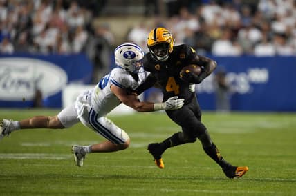 Sep 18, 2021; Provo, Utah, USA; Arizona State Sun Devils running back Daniyel Ngata (4) is defended by BYU Cougars linebacker Payton Wilgar (49) in the second half at LaVell Edwards Stadium. Mandatory Credit: Kirby Lee-USA TODAY Sports