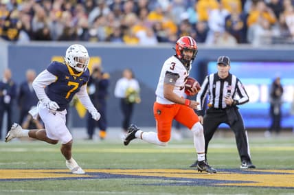 Nov 6, 2021; Morgantown, West Virginia, USA; Oklahoma State Cowboys quarterback Spencer Sanders (3) runs out of the pocket during the second quarter against the West Virginia Mountaineers at Mountaineer Field at Milan Puskar Stadium. Mandatory Credit: Ben Queen-USA TODAY Sports