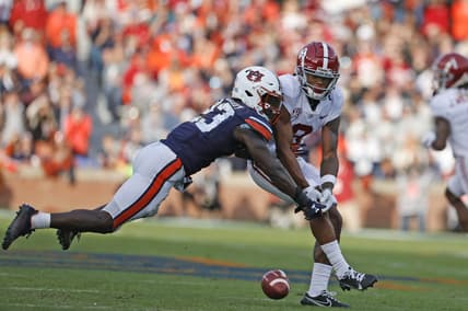Nov 27, 2021; Auburn, Alabama, USA;  Auburn Tigers cornerback Roger McCreary (23) breaks up a pass intended for Alabama Crimson Tide wide receiver John Metchie III (8) during the second quarter at Jordan-Hare Stadium. Mandatory Credit: John Reed-USA TODAY Sports