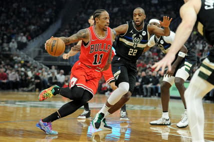 Jan 21, 2022; Milwaukee, Wisconsin, USA;  Chicago Bulls forward DeMar DeRozan (11) drives to the basket against Milwaukee Bucks forward Khris Middleton (22) in the first half at Fiserv Forum. Mandatory Credit: Michael McLoone-USA TODAY Sports