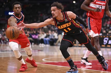 Mar 4, 2022; Washington, District of Columbia, USA;  Atlanta Hawks guard Trae Young (11) and Washington Wizards guard Brad Ish (4) react for a loose ball during the first half at Capital One Arena. Mandatory Credit: Tommy Gilligan-USA TODAY Sports