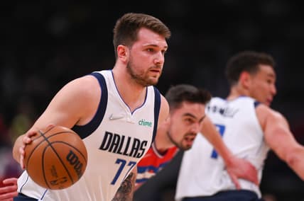 Apr 1, 2022; Washington, District of Columbia, USA;Dallas Mavericks guard Luka Doncic (77) dribble up court by Washington Wizards guard Tomas Satoransky (31)  during the first half at Capital One Arena. Mandatory Credit: Tommy Gilligan-USA TODAY Sports
