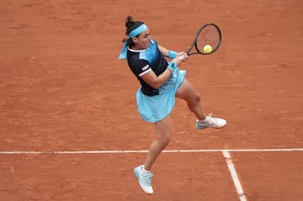 May 22, 2022; Paris, France;  Ons Jabeur (TUN) returns the ball during her match against Magda Linette (POL) on day one of the French Open at Stade Roland-Garros. Mandatory Credit: Susan Mullane-USA TODAY Sports