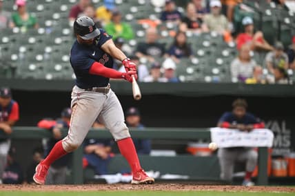 Sep 11, 2022; Baltimore, Maryland, USA; Boston Red Sox shortstop Xander Bogaerts (2) hits a ninth inning single against the Baltimore Orioles  at Oriole Park at Camden Yards. Mandatory Credit: Tommy Gilligan-USA TODAY Sports