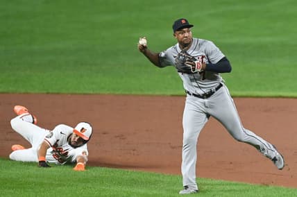 Sep 19, 2022; Baltimore, Maryland, USA; Detroit Tigers second baseman Jonathan Schoop (7) throws to first base after tagging out Baltimore Orioles right fielder Anthony Santander (25) in the seventh inning  at Oriole Park at Camden Yards. Mandatory Credit: Tommy Gilligan-USA TODAY Sports
