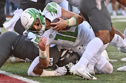 Sep 24, 2022; Pullman, Washington, USA; Oregon Ducks quarterback Bo Nix (10) is stopped short of the goalie by Washington State Cougars linebacker Travion Brown (82) in the second half at Gesa Field at Martin Stadium. Ducks won 44-41. Mandatory Credit: James Snook-USA TODAY Sports