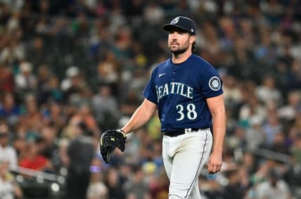 Sep 27, 2022; Seattle, Washington, USA; Seattle Mariners starting pitcher Robbie Ray (38) walks off the field after striking out Texas Rangers left fielder Bubba Thompson (65) (not pictured) to end the top of the fifth inning at T-Mobile Park. Mandatory Credit: Steven Bisig-USA TODAY Sports