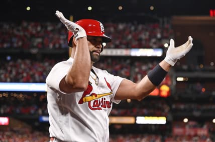 Sep 30, 2022; St. Louis, Missouri, USA;  St. Louis Cardinals designated hitter Albert Pujols (5) reacts after hitting a solo home run for his 701st career home run during the fourth inning against the Pittsburgh Pirates at Busch Stadium. Mandatory Credit: Jeff Curry-USA TODAY Sports
