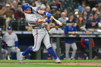 Sep 27, 2022; Seattle, Washington, USA; Texas Rangers third baseman Josh Jung (6) hits a home run against the Seattle Mariners during the second inning at T-Mobile Park. Mandatory Credit: Steven Bisig-USA TODAY Sports