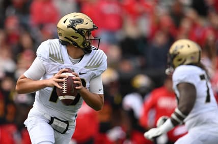 Oct 8, 2022; College Park, Maryland, USA;  Purdue Boilermakers quarterback Aidan O'Connell (16) rolls out to pass during the first half against the Purdue Boilermakers at SECU Stadium. Mandatory Credit: Tommy Gilligan-USA TODAY Sports