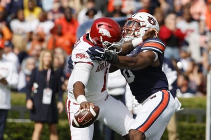 Oct 29, 2022; Auburn, Alabama, USA;  Auburn Tigers linebacker Owen Pappoe (0) sacks Arkansas Razorbacks quarterback KJ Jefferson (1) on the opening play at Jordan-Hare Stadium. Mandatory Credit: John Reed-USA TODAY Sports