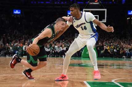 Oct 30, 2022; Boston, Massachusetts, USA; Boston Celtics guard Payton Pritchard (11) controls the ball while Washington Wizards forward Isaiah Todd (14) defends during the second half at TD Garden. Mandatory Credit: Bob DeChiara-USA TODAY Sports