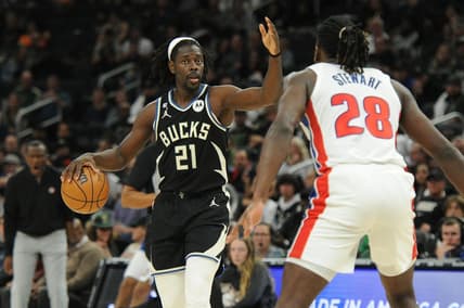 Oct 31, 2022; Milwaukee, Wisconsin, USA; Milwaukee Bucks guard Jrue Holiday (21) brings the ball up the court against Detroit Pistons center Isaiah Stewart (28) at Fiserv Forum. Mandatory Credit: Michael McLoone-USA TODAY Sports