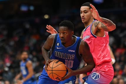 Nov 10, 2022; Washington, District of Columbia, USA;  Dallas Mavericks forward Dorian Finney-Smith (10) looks to pass as Washington Wizards forward Kyle Kuzma (33) defends during the first half at Capital One Arena. Mandatory Credit: Tommy Gilligan-USA TODAY Sports