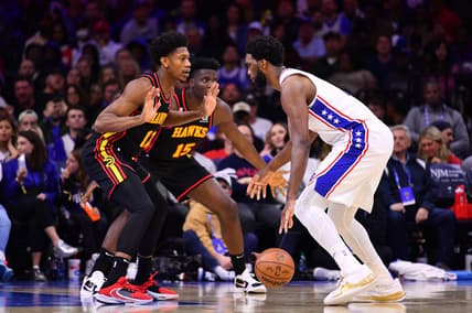 Nov 12, 2022; Philadelphia, Pennsylvania, USA; Atlanta Hawks forward De'Andre Hunter (12) defends Philadelphia 76ers center Joel Embiid (21) in the second quarter at Wells Fargo Center. Mandatory Credit: Kyle Ross-USA TODAY Sports