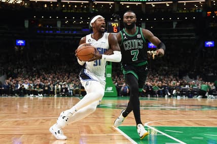 Dec 18, 2022; Boston, Massachusetts, USA;  Orlando Magic guard Terrence Ross (31) drives to the basket while Boston Celtics guard Jaylen Brown (7) defends during the first half at TD Garden. Mandatory Credit: Bob DeChiara-USA TODAY Sports
