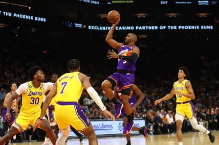 Dec 19, 2022; Phoenix, Arizona, USA; Phoenix Suns guard Chris Paul (3) drives to the hoop against the Los Angeles Lakers in the second half at Footprint Center. Mandatory Credit: Mark J. Rebilas-USA TODAY Sports