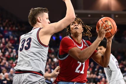 Jan 19, 2023; Spokane, Washington, USA; Loyola Marymount Lions forward Michael Graham (21) shoots the ball against Gonzaga Bulldogs forward Ben Gregg (33) in the first half at McCarthey Athletic Center. Mandatory Credit: James Snook-USA TODAY Sports