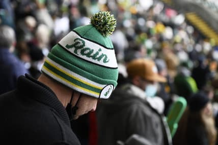 Feb 26, 2022; Portland, Oregon, USA; A Portland Timbers fan keeps warm in a stocking cap before a game against the New England Revolution at Providence Park. The weather report calls for rain on opening day. Mandatory Credit: Troy Wayrynen-USA TODAY Sports