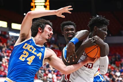 Dec 31, 2022; Spokane, Washington, USA; UCLA Bruins guard Jaime Jaquez Jr. (24) fights for the ball against Washington State Cougars forward Mouhamed Gueye (35) in the second half at McCarthey Athletic Center. Mandatory Credit: James Snook-USA TODAY Sports