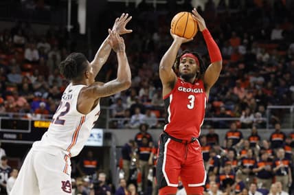 Feb 1, 2023; Auburn, Alabama, USA;  Georgia Bulldogs guard Kario Oquendo (3) goes over Auburn Tigers guard Allen Flanigan (22) for a shot during the first half at Neville Arena. Mandatory Credit: John Reed-USA TODAY Sports