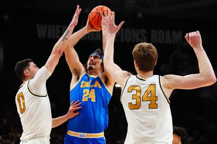 Feb 26, 2023; Boulder, Colorado, USA; UCLA Bruins guard Jaime Jaquez Jr. (24) shoots the ball between Colorado Buffaloes guard Luke O'Brien (0) and center Lawson Lovering (34) in the second half at the CU Events Center. Mandatory Credit: Ron Chenoy-USA TODAY Sports