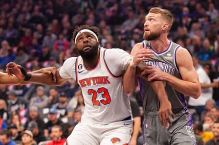 Mar 9, 2023; Sacramento, California, USA; New York Knicks center Mitchell Robinson (23) and Sacramento Kings forward Domantas Sabonis (10) fight for position under the basket during the first quarter at Golden 1 Center. Mandatory Credit: Ed Szczepanski-USA TODAY Sports