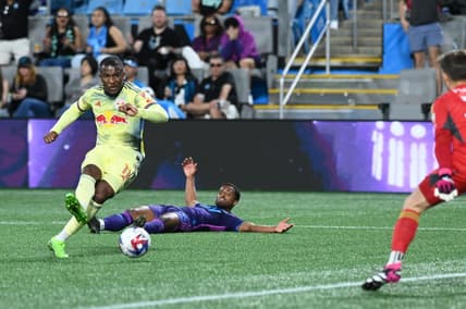 Mar 25, 2023; Charlotte, North Carolina, USA; New York Red Bulls attacker Elias Manoel (11) shoots goal in the first half against Charlotte FC at Bank of America Stadium. Mandatory Credit: Griffin Zetterberg-USA TODAY Sports