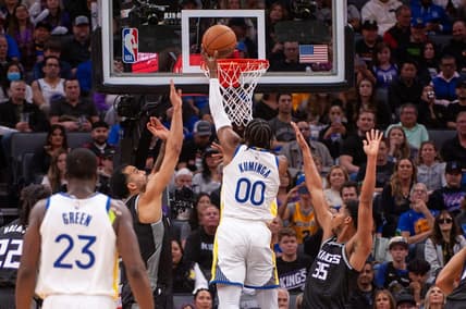 Apr 7, 2023; Sacramento, California, USA; Golden State Warriors forward Jonathan Kuminga (00) puts up a shot during the second quarter against the Sacramento Kings at Golden 1 Center. Mandatory Credit: Ed Szczepanski-USA TODAY Sports