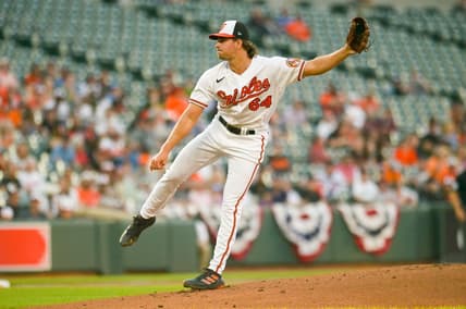 Apr 12, 2023; Baltimore, Maryland, USA;  Baltimore Orioles starting pitcher Dean Kremer (64) throws a first inning pitch against the Oakland Athletics at Oriole Park at Camden Yards. Mandatory Credit: Tommy Gilligan-USA TODAY Sports