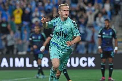 Apr 22, 2023; Charlotte, North Carolina, USA; Charlotte FC attacker Karol Swiderski (11) celebrates after scoring a goal against Columbus Crew in the first half at Bank of America Stadium. Mandatory Credit: Griffin Zetterberg-USA TODAY Sports