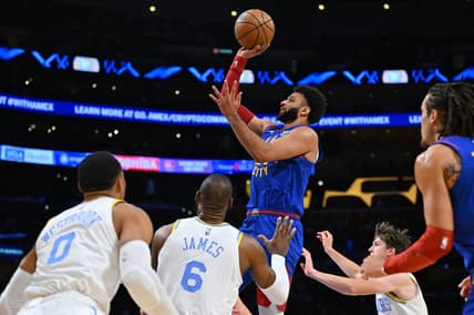 Oct 30, 2022; Los Angeles, California, USA;  Denver Nuggets guard Jamal Murray (27) goes up for a basket as Los Angeles Lakers guard Russell Westbrook (0) and forward LeBron James (6) look on in the first half at Crypto.com Arena. Mandatory Credit: Jayne Kamin-Oncea-USA TODAY Sports
