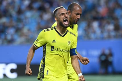 May 20, 2023; Charlotte, North Carolina, USA; Nashville SC midfielder Hany Mukhtar (10) celebrates his goal scored in the first half against Charlotte FC to tie the score 1-1 at Bank of America Stadium. Mandatory Credit: Griffin Zetterberg-USA TODAY Sports