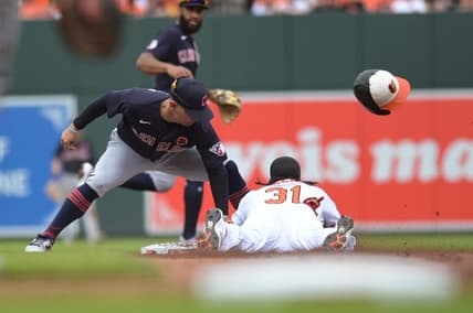 May 29, 2023; Baltimore, Maryland, USA;  Cleveland Guardians second baseman Andres Gimenez (0) tags Baltimore Orioles center fielder Cedric Mullins (31) out on a first inning steal attempts at Oriole Park at Camden Yards. Mandatory Credit: Tommy Gilligan-USA TODAY Sports