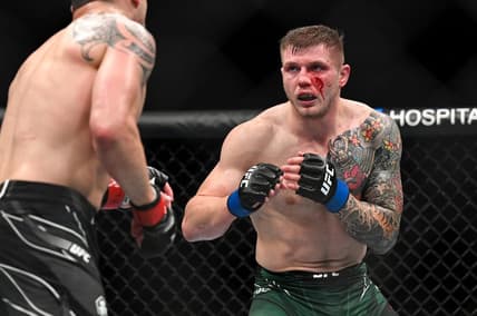 Sep 3, 2022; Paris, FRANCE; Robert Whittaker (red gloves) and Marvin Vettori (blue gloves) during UFC Fight Night at Accor Arena. Mandatory Credit: Per Haljestam-USA TODAY Sports