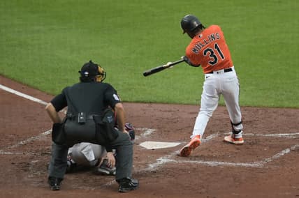 Jul 15, 2023; Baltimore, Maryland, USA; Baltimore Orioles center fielder Cedric Mullins (31) hits a rbi single scoring first baseman Ryan Mountcastle (not pictured) during the second inning  against the Miami Marlins at Oriole Park at Camden Yards. Mandatory Credit: Tommy Gilligan-USA TODAY Sports