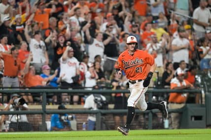 Jul 15, 2023; Baltimore, Maryland, USA;  Baltimore Orioles left fielder Austin Hays (21) scores on right fielder Anthony Santander (not pictured) seventh inning single against the Miami Marlins at Oriole Park at Camden Yards. Mandatory Credit: Tommy Gilligan-USA TODAY Sports