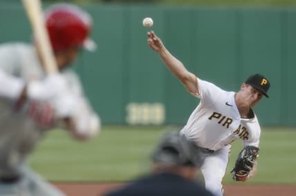 Jul 29, 2023; Pittsburgh, Pennsylvania, USA;  Pittsburgh Pirates starting pitcher Quinn Priester (64) throws to Philadelphia Phillies right fielder Nick Castellanos (8) during the third inning at PNC Park. Mandatory Credit: Charles LeClaire-USA TODAY Sports