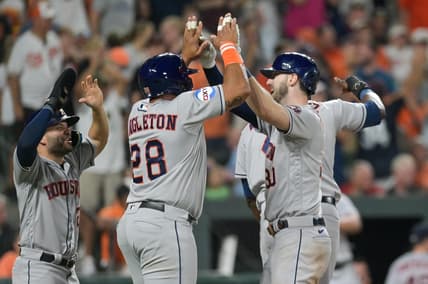 Aug 8, 2023; Baltimore, Maryland, USA; Houston Astros right fielder Kyle Tucker (30) celebrates with pinch hitter John Singleton (28) and second baseman Jose Altuve (27) at home pate after hitting a grand slam in the ninth inning against the Baltimore Orioles  at Oriole Park at Camden Yards. Mandatory Credit: Tommy Gilligan-USA TODAY Sports