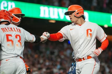 Aug 15, 2023; San Francisco, California, USA;  San Francisco Giants third baseman Wilmer Flores (41) celebrates with right fielder Wade Meckler (53) after hitting a home run during the sixth inning against the Tampa Bay Rays at Oracle Park. Mandatory Credit: Ed Szczepanski-USA TODAY Sports