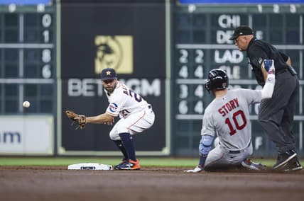 Aug 23, 2023; Houston, Texas, USA; Boston Red Sox shortstop Trevor Story (10) is safe at second base with a double as Houston Astros second baseman Jose Altuve (27) attempts to field a throw during the second inning at Minute Maid Park. Mandatory Credit: Troy Taormina-USA TODAY Sports