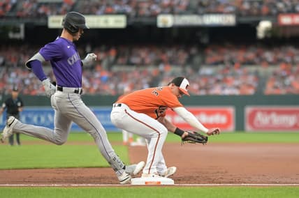 Aug 26, 2023; Baltimore, Maryland, USA;  Baltimore Orioles first baseman Ryan Mountcastle (6) secures the ball for the forecourt of Colorado Rockies right fielder Nolan Jones (22) during the second inning at Oriole Park at Camden Yards. Mandatory Credit: Tommy Gilligan-USA TODAY Sports