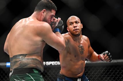Sep 3, 2022; Paris, FRANCE; Ciryl Gane (red gloves) and Tai Tuivasa (blue gloves) during UFC Fight Night at Accor Arena. Mandatory Credit: Per Haljestam-USA TODAY Sports