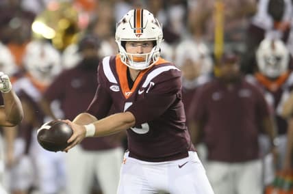Sep 2, 2023; Blacksburg, Virginia, USA;  Virginia Tech Hokies quarterback Grant Wells (6)  hands off ball in the second quarter against the Old Dominion Monarchs at Lane Stadium. Mandatory Credit: Lee Luther Jr.-USA TODAY Sports
